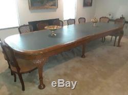 Large elegant Chippendale style conference table with 16 matching chairs