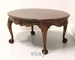 Late 20th Century Bookmatched Walnut Chippendale Cocktail Table