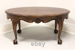 Late 20th Century Bookmatched Walnut Chippendale Cocktail Table
